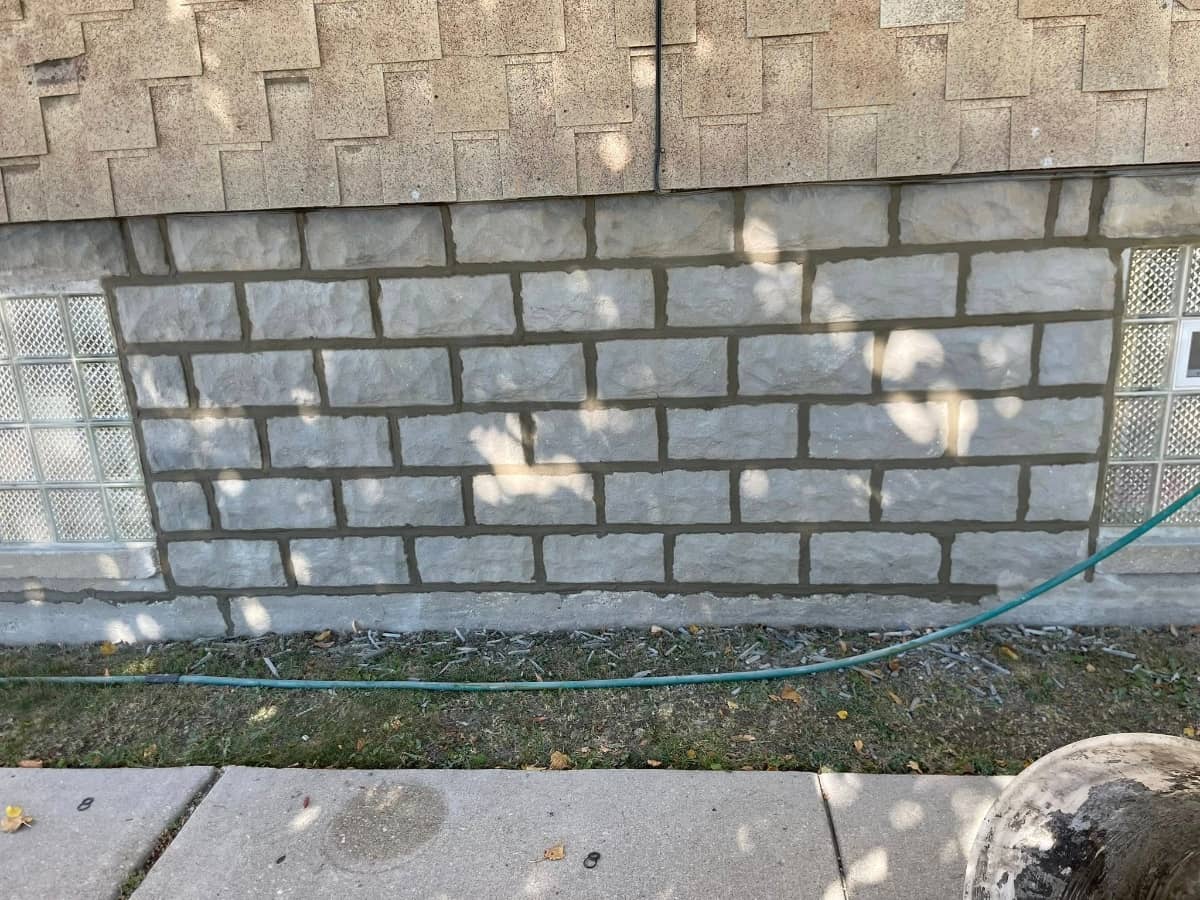 Concrete bricks installed on side of home