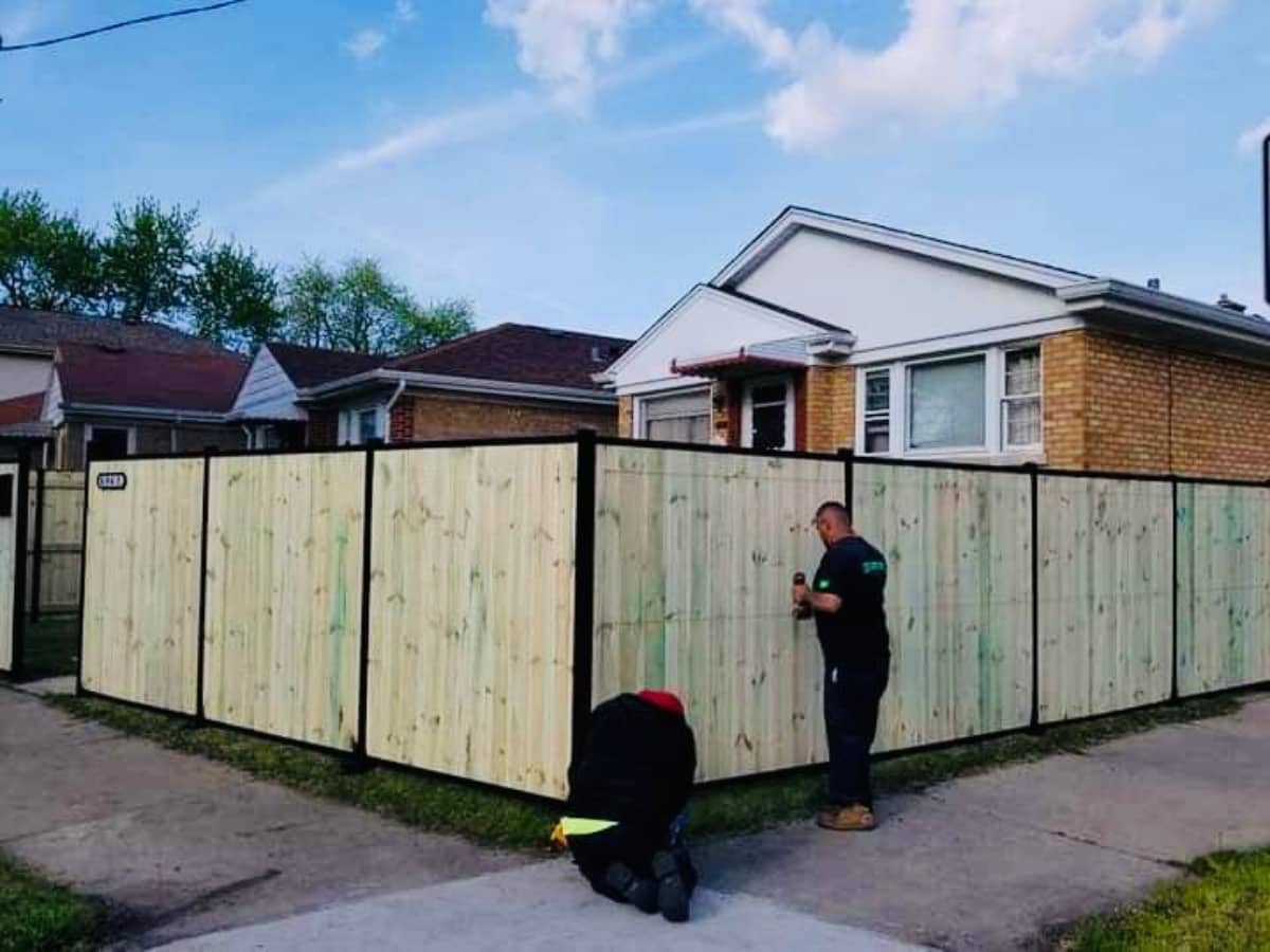 wood fence installed in backyard